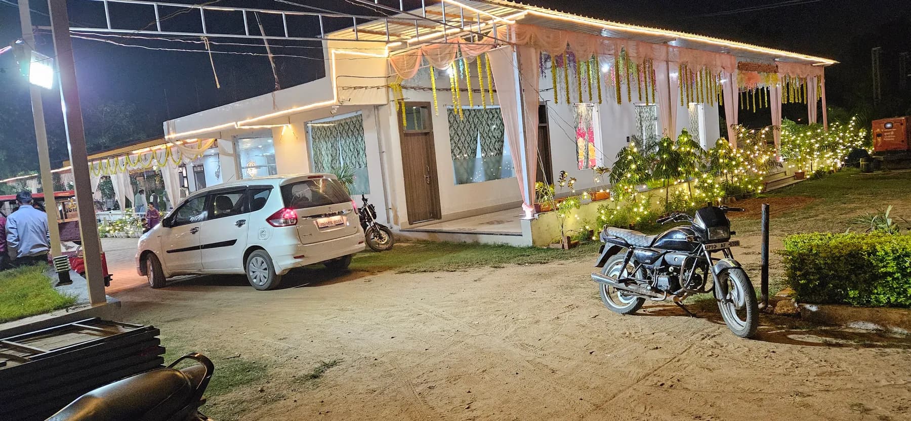 Bandhan Marriage Hall venue exterior with parking at night