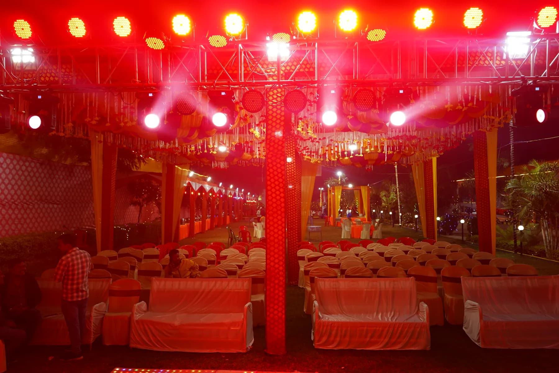 Outdoor mandap with red lighting