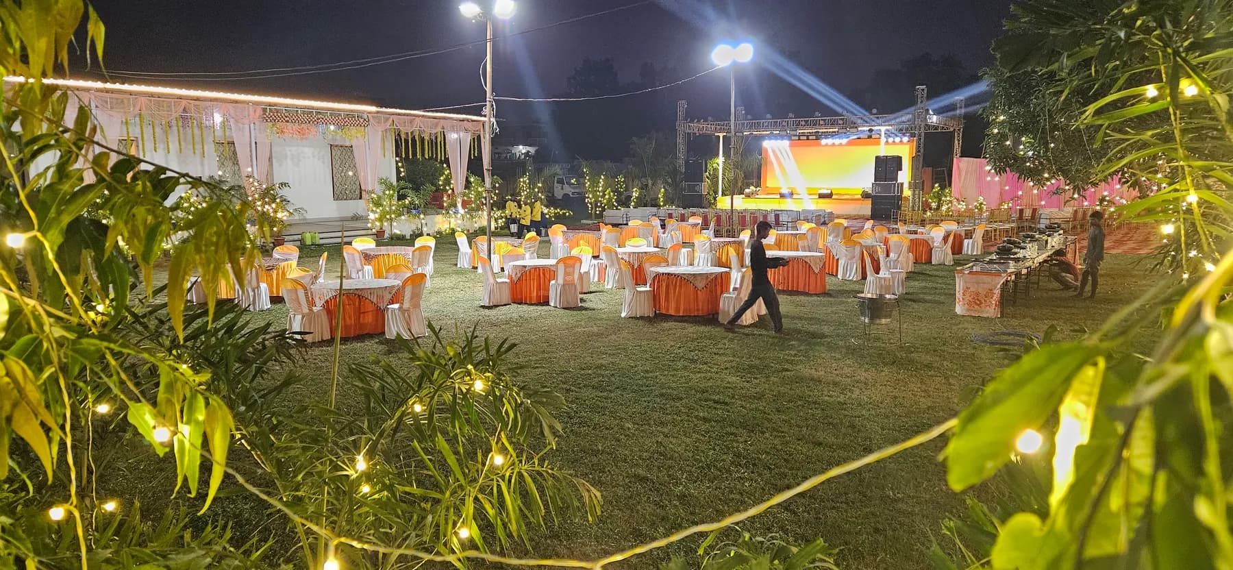 Outdoor lawn dining with fairy lights at Bandhan Marriage Hall